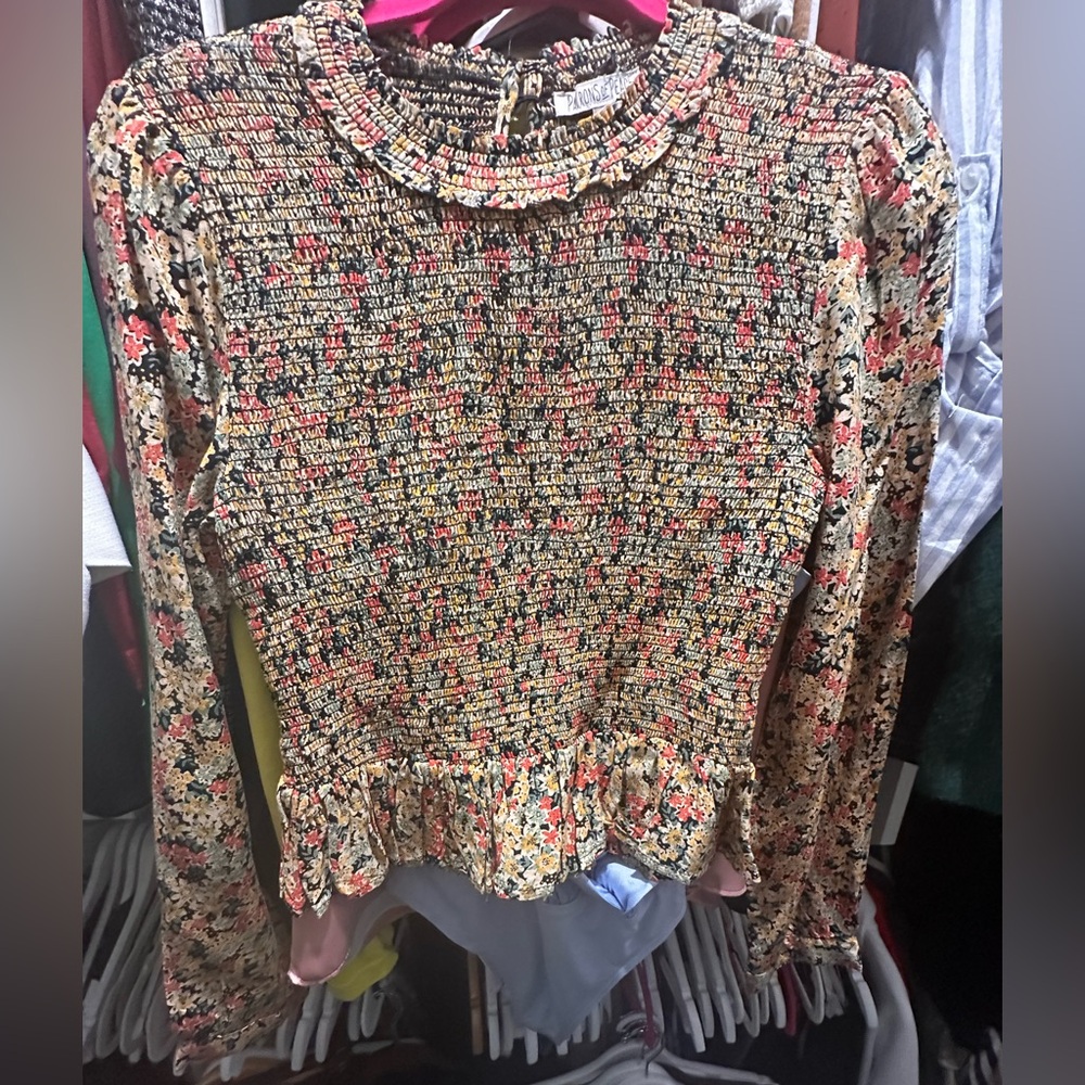 Schmocked Tiered crop top blouse with long sleeves.